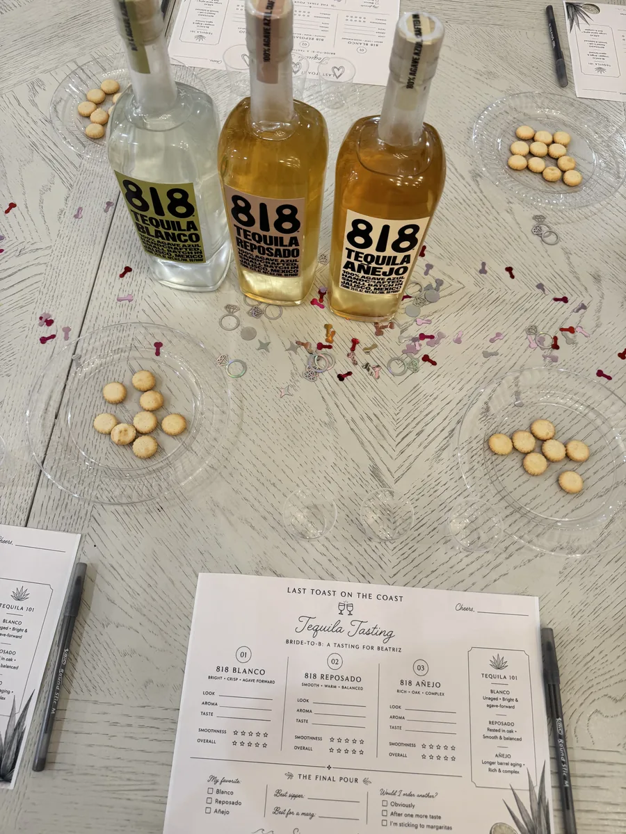A Happy Pour tequila tasting with blanco, reposado and añejo bottles, snacks and custom tasting cards