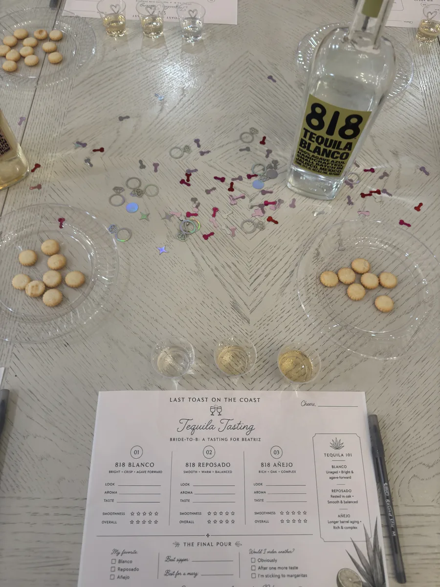 A tequila tasting table with tasting glasses, snacks and a custom tasting card for each guest
